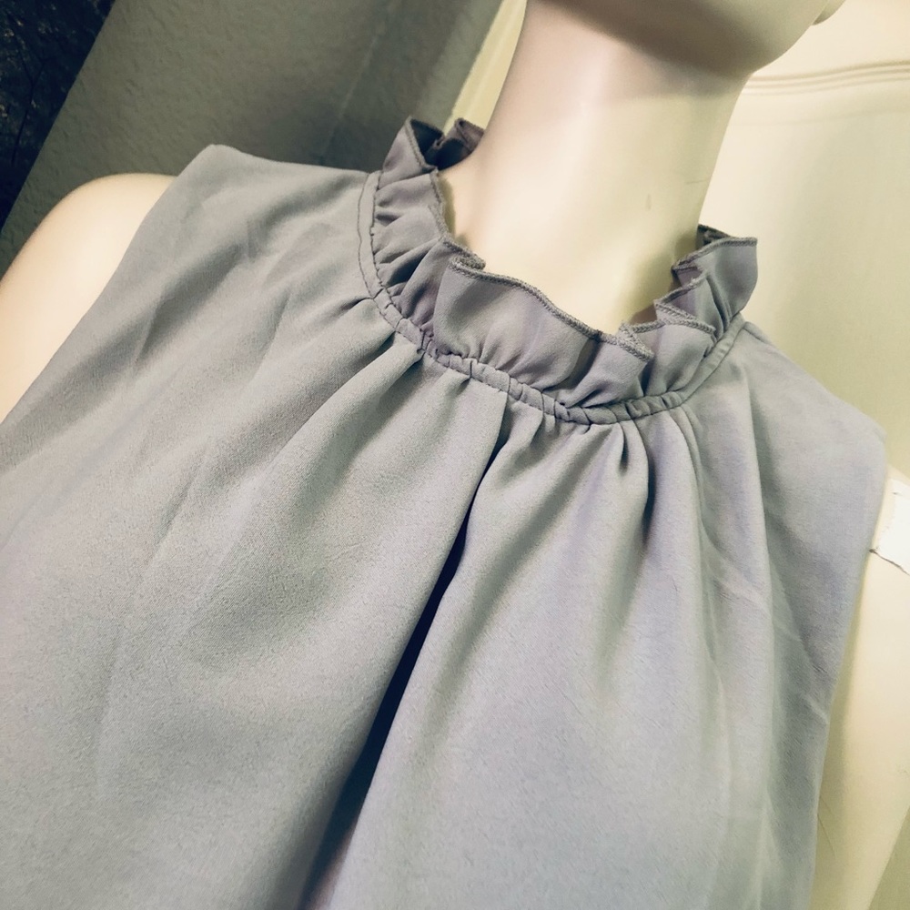 Ruffled neck sleeveless top